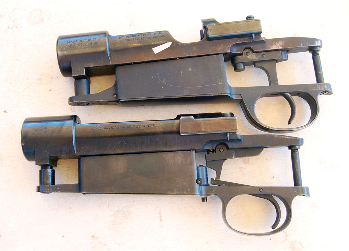 The presence of a thumb cut (arrow) means it is  a military action (top). The commercial action (bottom) has none.